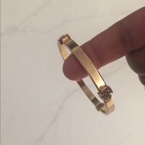 Tory Burch original T logo gold bangle.